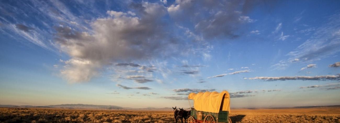 Covered wagon travels the Oregon-California-Pony Express Historic Trail, Wyoming, photo by Bob Wick, BLM