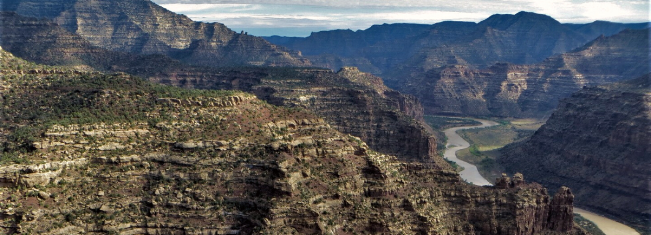 Mountain landscape with a river flowing the the canyons. 