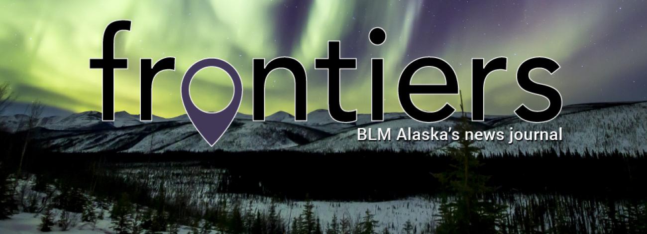Frontiers. BLM Alaska News Journal. Photo of green northern light in the night sky over White Mountains National Recreation Area in Alaska