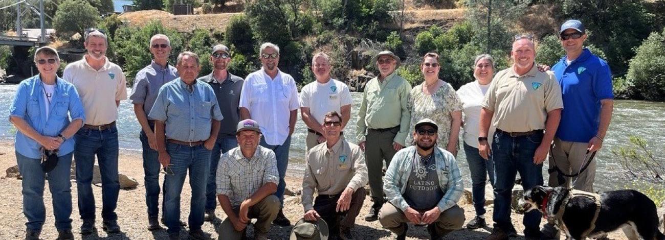 Group photo of Resource Advisory Council on a river bank