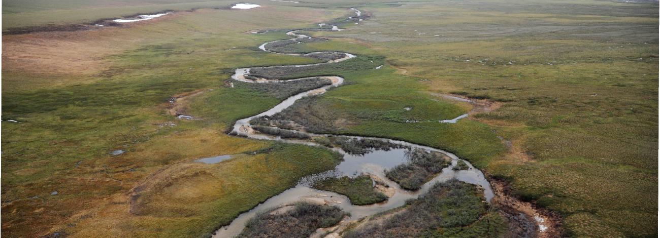 Aerial photo of river on flat tundra