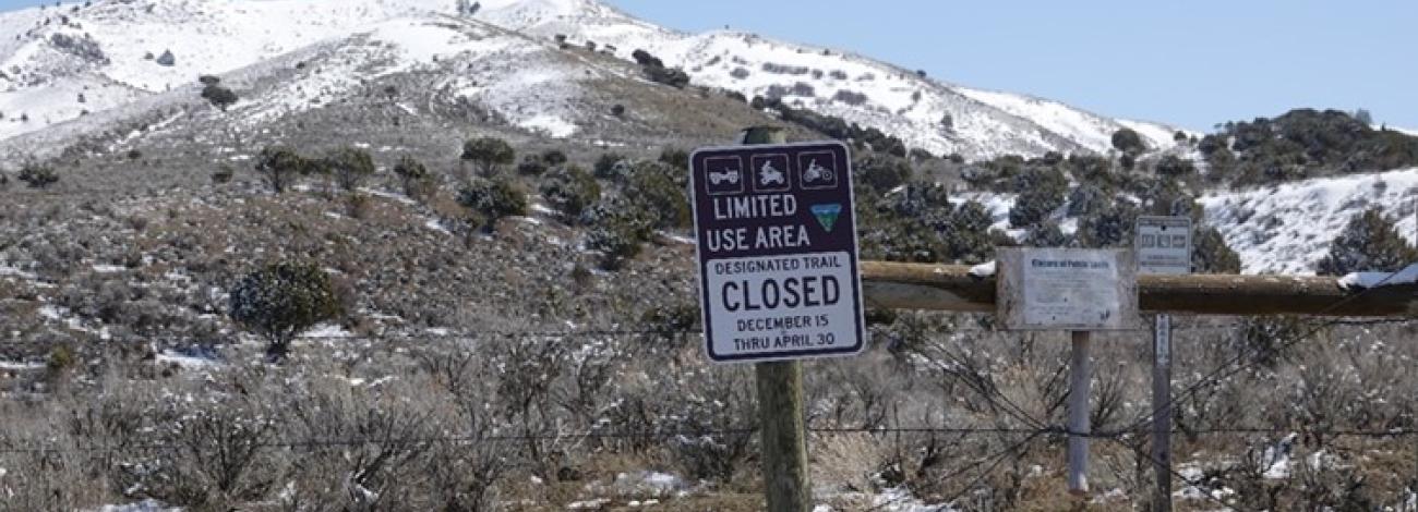 A temporary closure sign limiting human access and vehicle traffic to the Stinking Springs area to protect wildlife.