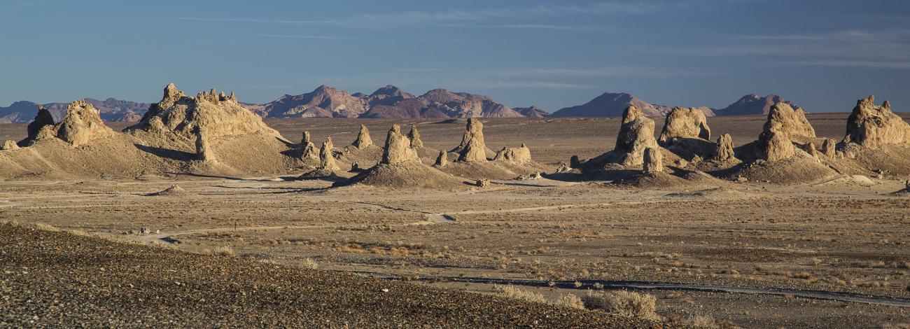 Tall tufas tower over the desert floor.