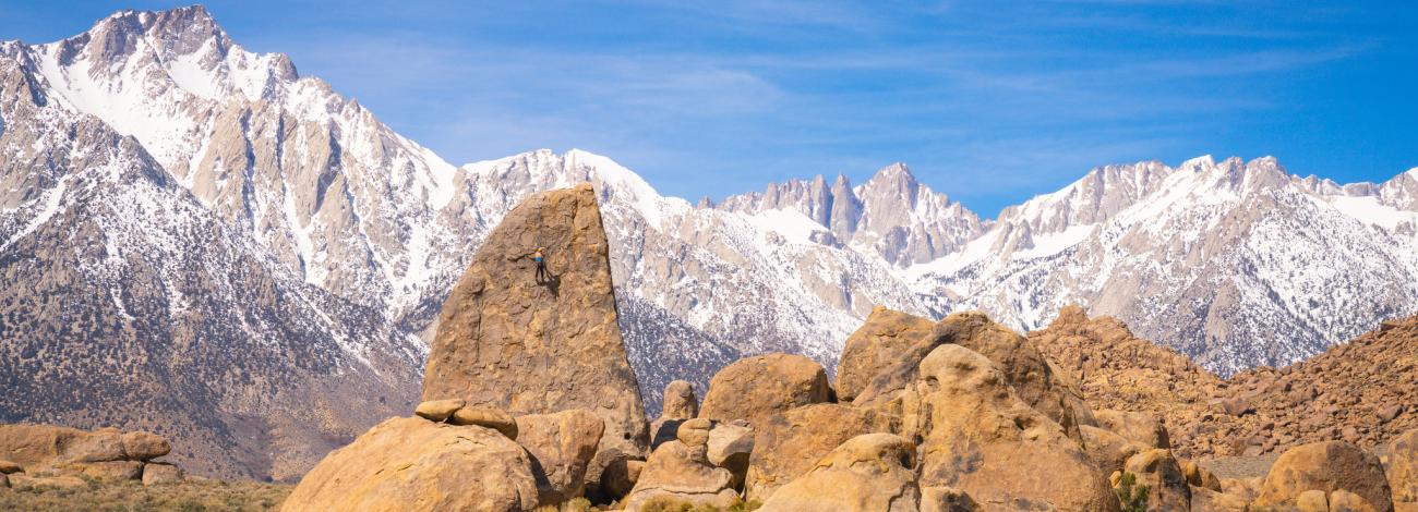 Granitehills with tall grey mountains in the background.