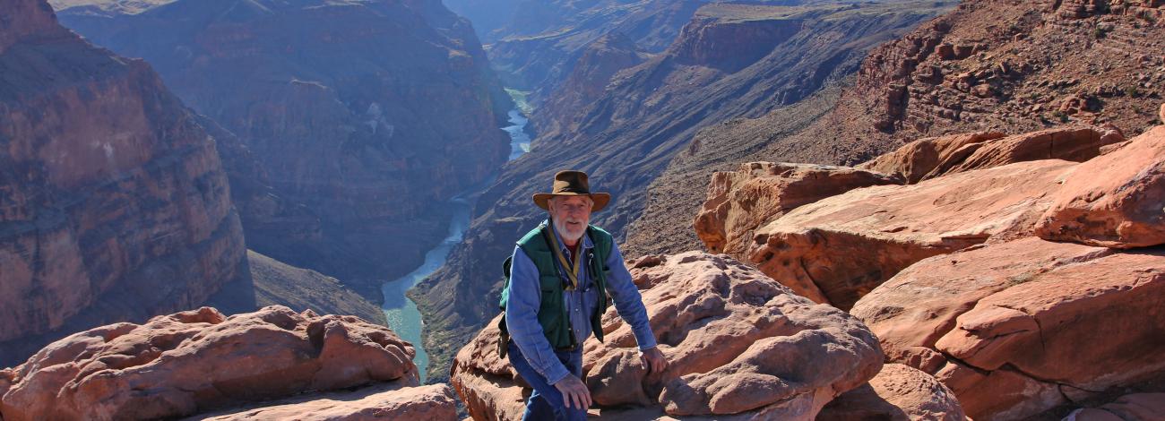 Doug Page leans against a rock at Toroweap Outlook in Grand Canyon National Park.