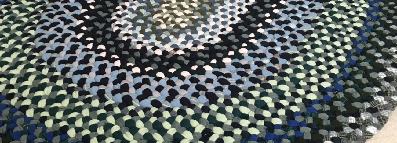 multi-colored wool braided rug. 