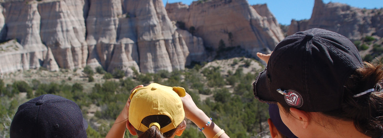 Children stand on an overlook at children Kasha-Katuwe Tent Rocks