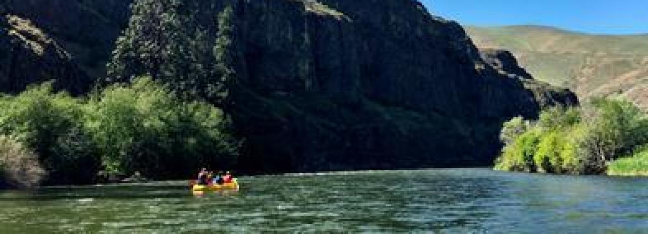 folks floating on the river on a sunny day