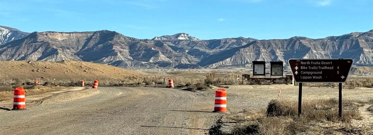 Road construction barrels along road work in North Fruita Desert Special Recreation Management Area
