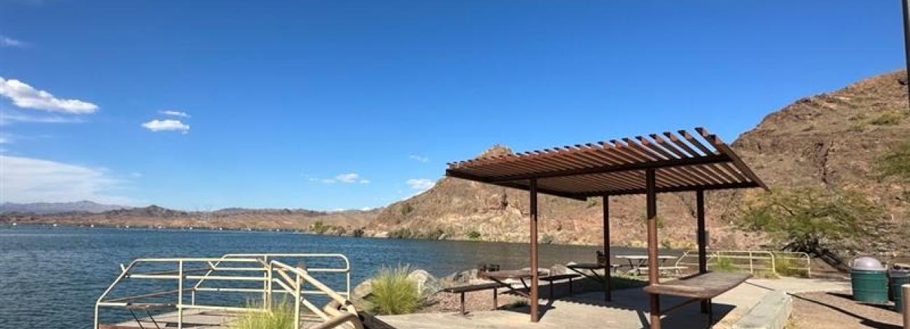 Fishing pier and shade structure for fish cleaning at Take Off Point.