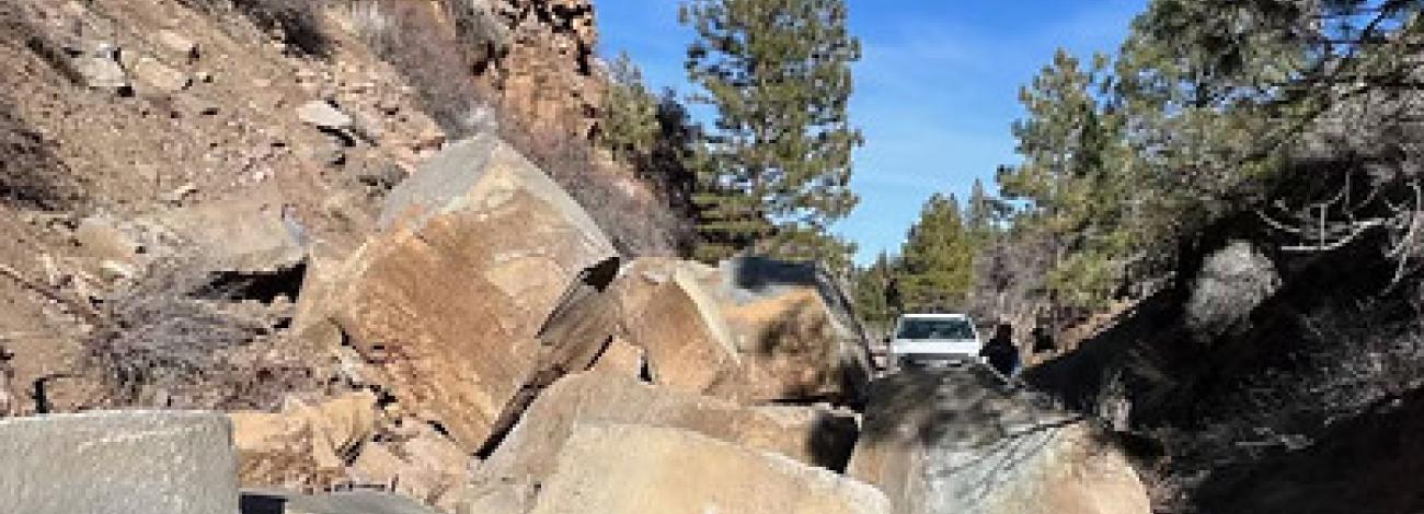 Boulders block a bike trail in the high desert