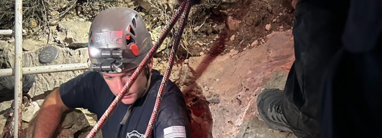 A firefighter enters the Wind-Hicks Cave near Carlsbad, N.M., during a cave rescue March 12.