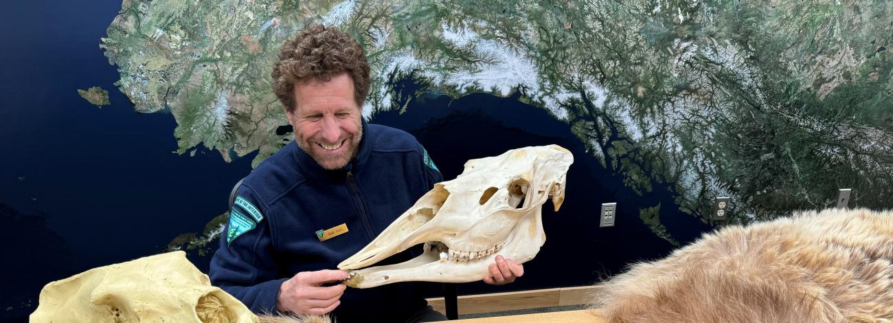 Educator holds up skull for distance learning program