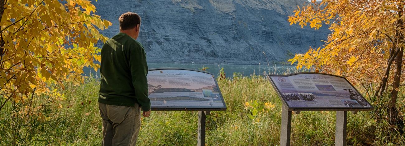 visitor reading interpretive signage at Upper Missouri River Breaks National Monument