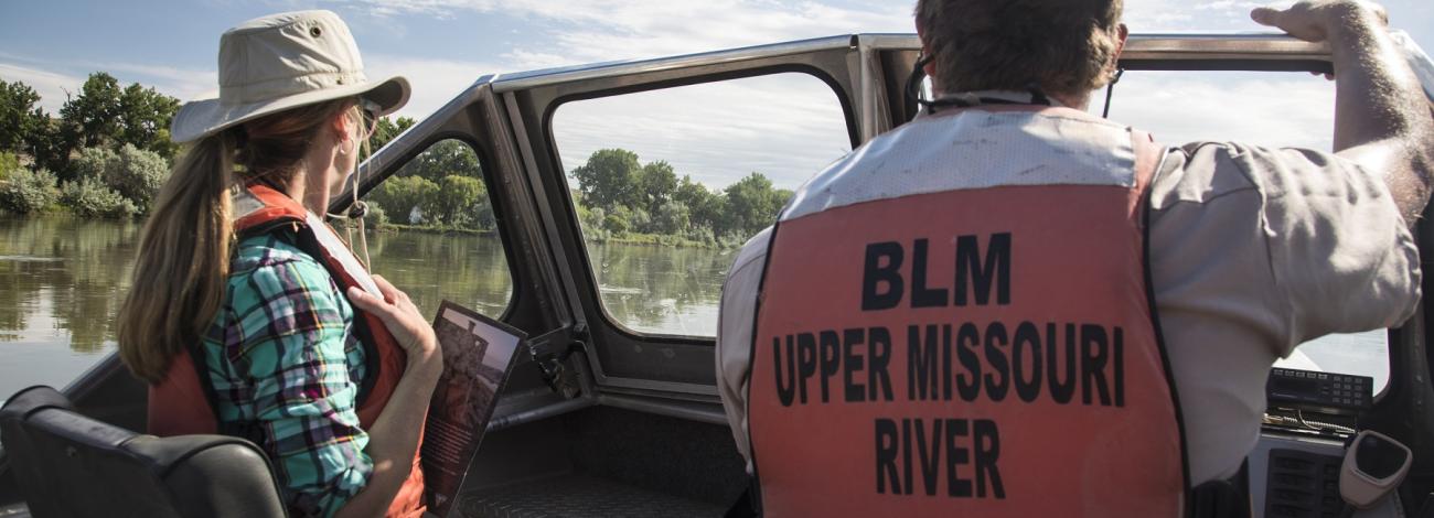 river rangers on a boat