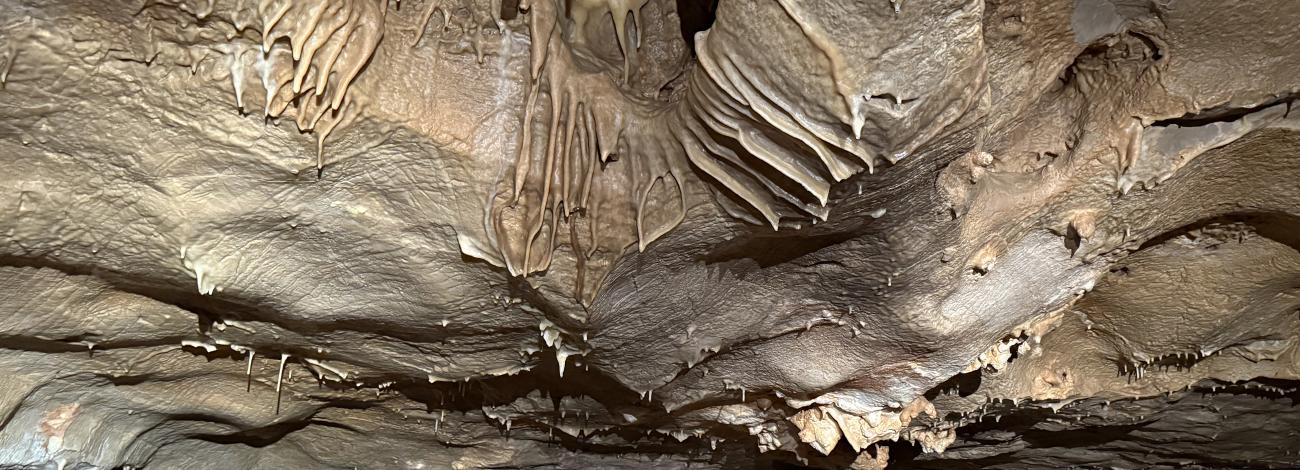 Two people explore a cave