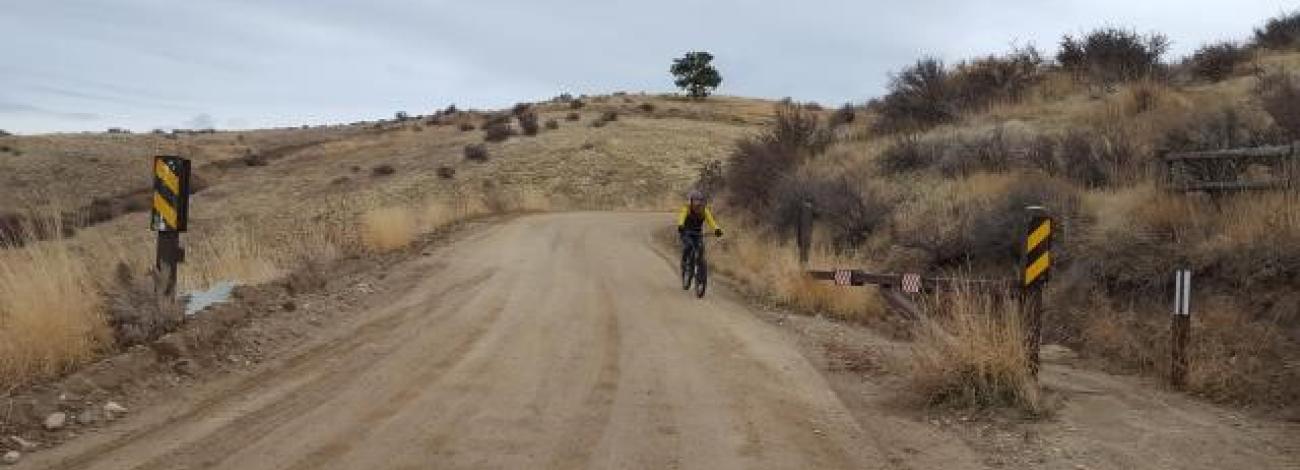 A cyclist riding on the upper 8th Street in the Boise Foothills 