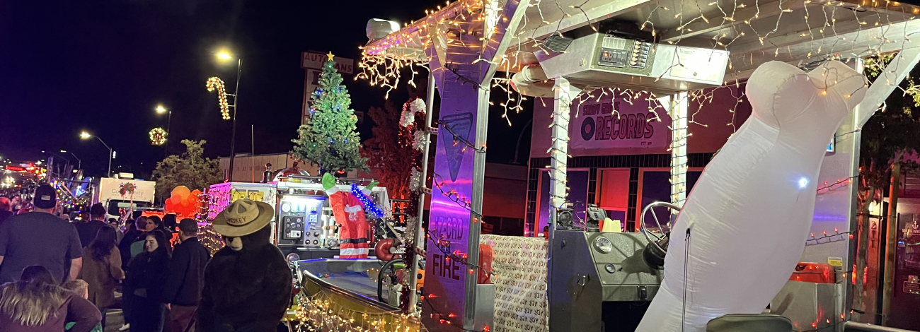 Nighttime street scene decorated in Christmas lights