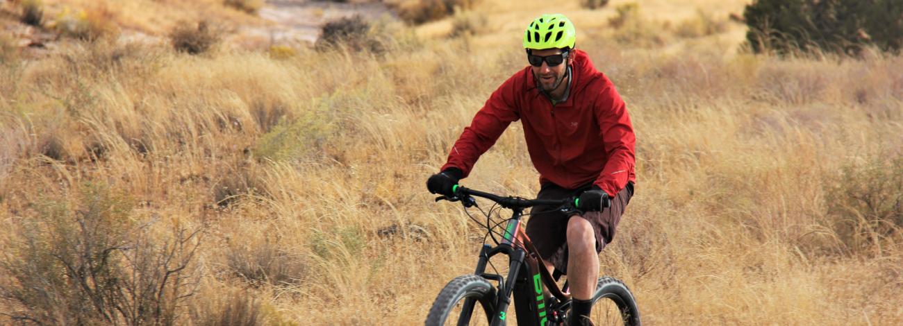 A man rides an e-bike on BLM-managed public lands in Western Colorado.