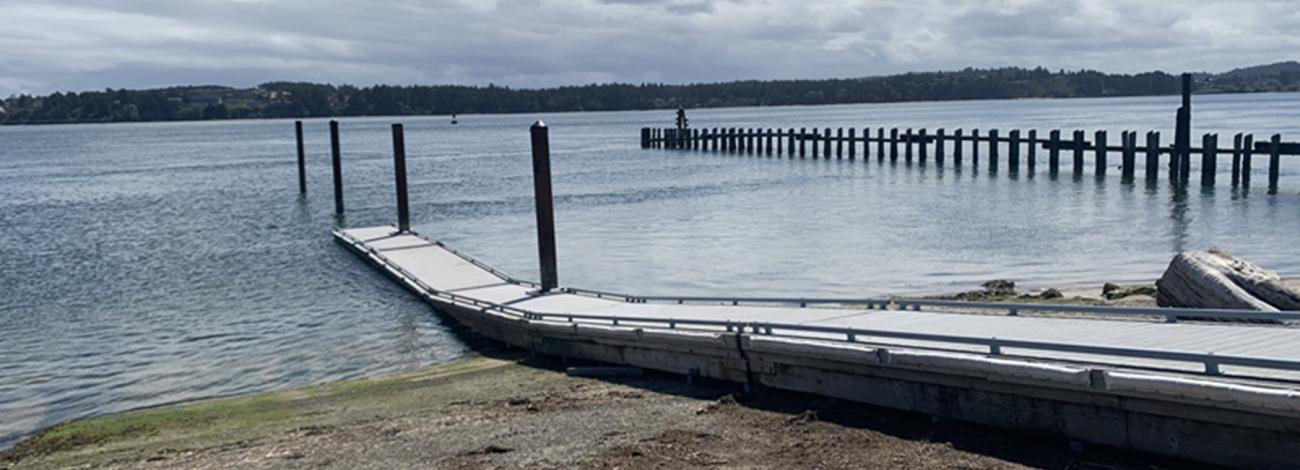 boat dock leading into the water 