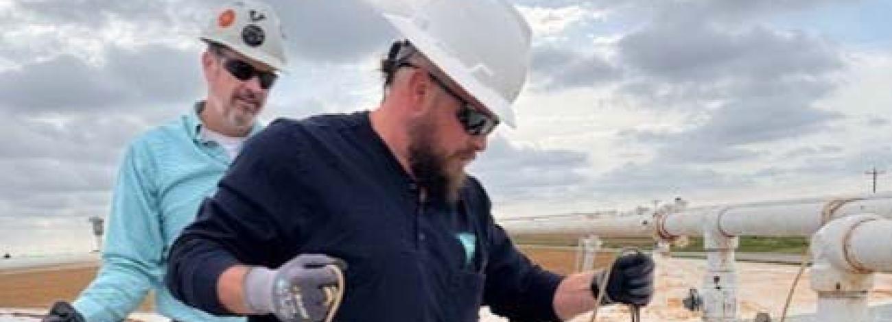 Students at PET Module 4 Oil Measurement gauge an oil storage tank to determine the quantity and quality of the oil in the tank.