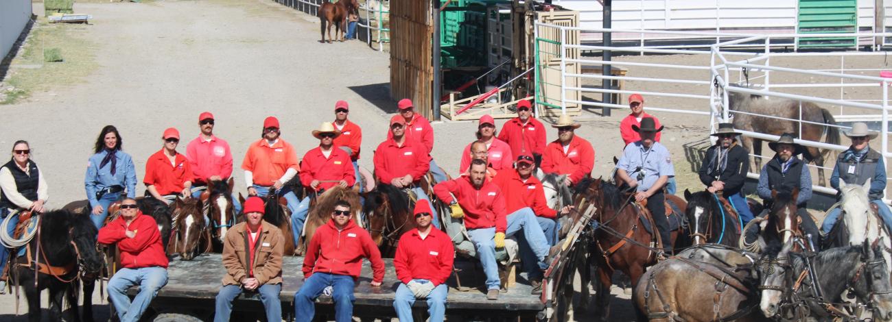 Wyoming Honor Farm team poses for photo with the backdrop being the farm