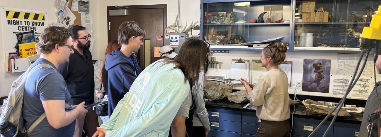 People look around inside a lab