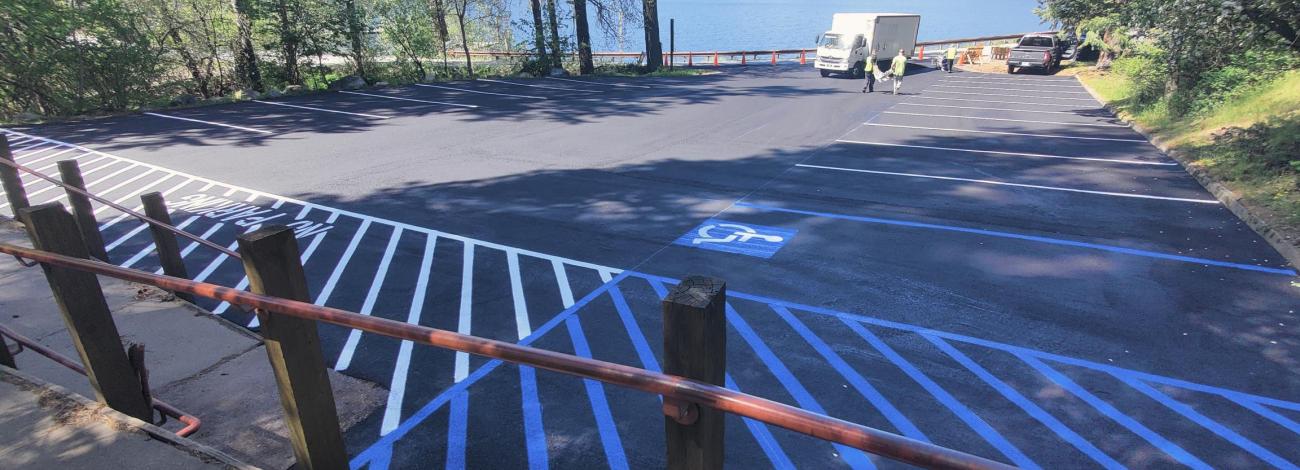 Image of freshly resurfaced asphalt parking area