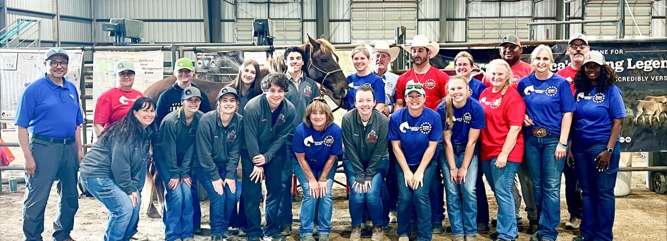 BLM Eastern States Director, Mitchell Leverette and Shayne Banks, Deputy District Manager for the Southeastern States District Office pause for a photo with the BLM SSDO Wild Horse and Burro team (from left to right: Dominique Wood, WHB Coordinator; Lindsay Rasmussen, WHB Coordinator; Greg Reynolds, Mustang Heritage Foundation trainer; Megan Velasquez, WHB Compliance Specialist; Matt Anderson, WHB Coordinator; Michelle Maraman, volunteer; Demetris Sanders, WHB Program Supervisor; Shawn Farnsworth, WHB Coord