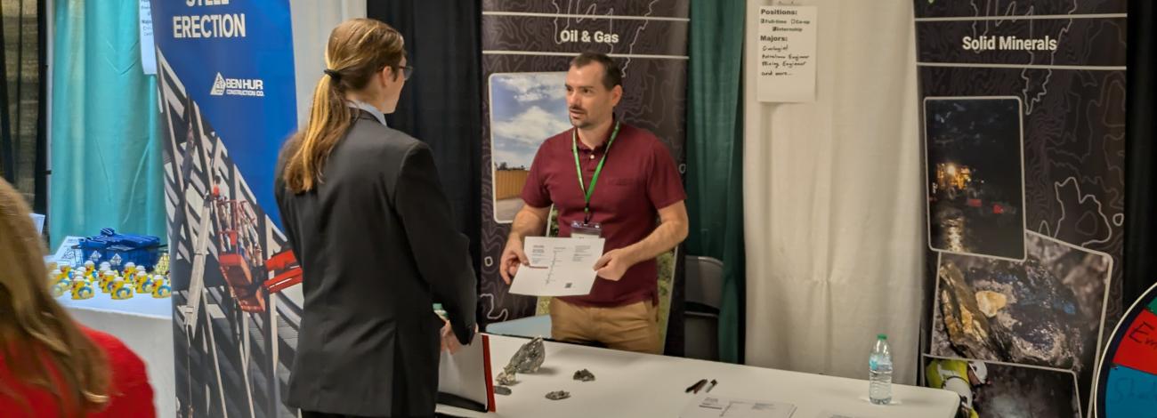 Career fair booth for the Bureau of Land Management, featuring oil and gas and solid minerals displays.