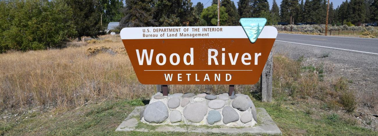 Sign for the Bureau of Land Management Wood River Wetland along a roadside.