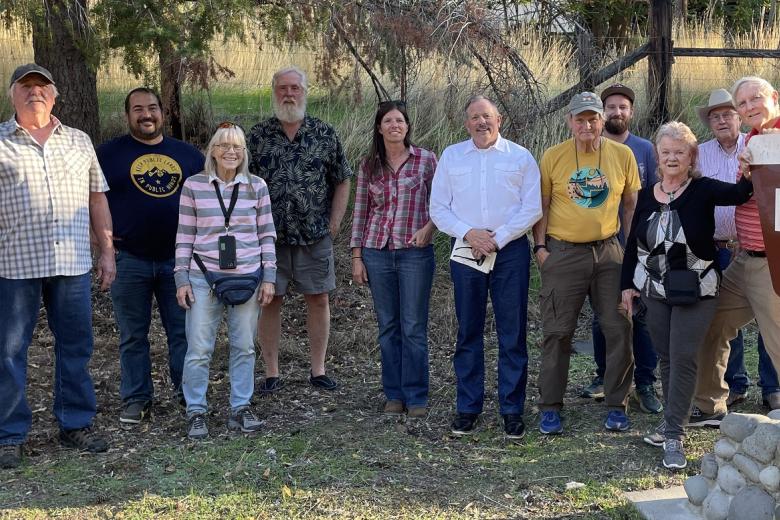 group of RAC members posing near a BLM sign reading Depot House Historic Site