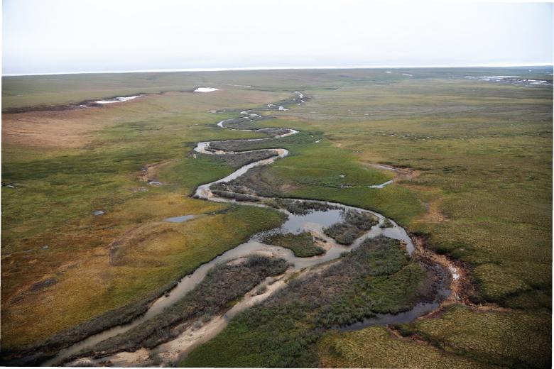 Aerial photo of river on flat tundra
