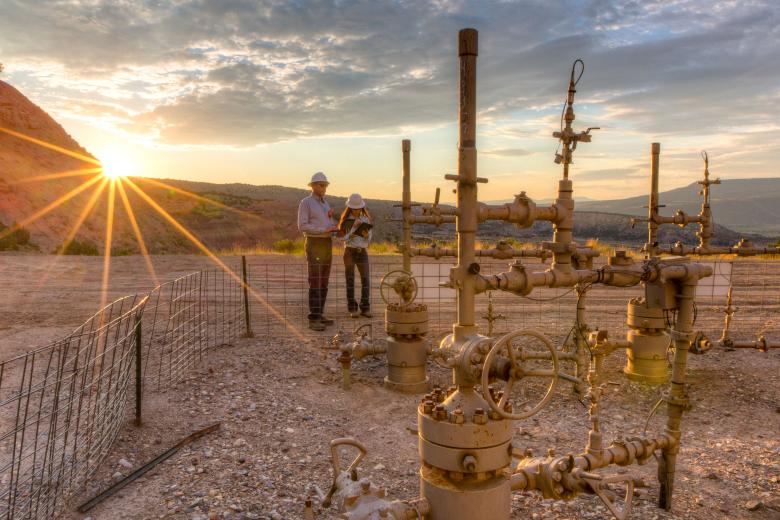 Two BLM workers at an oil and gas facility in Colorado.