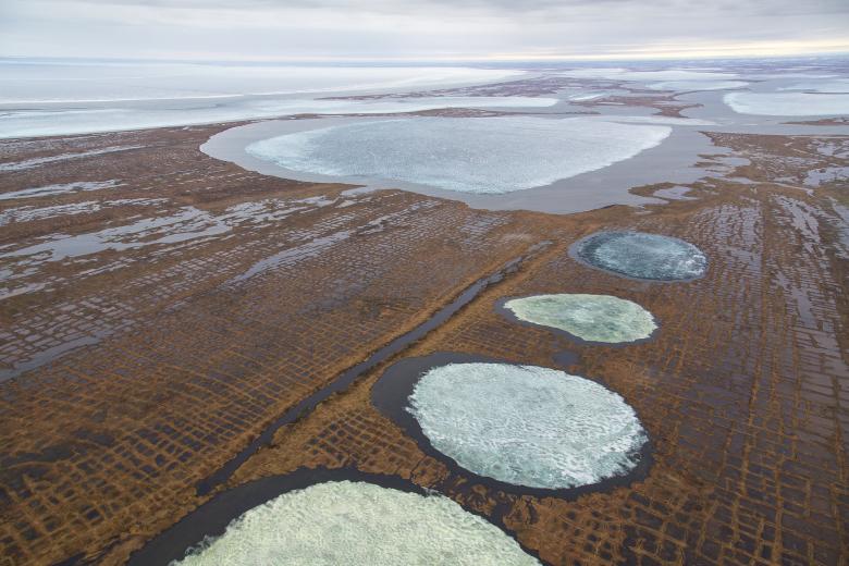 Several partially frozen lakes in late fall in the National Petroleum Reserve in Alaska.