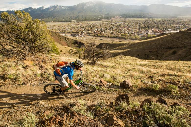 Bike rider on the Salida trail on the ridge above Salida, CO.