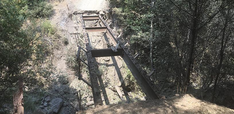 Pictured is a trail bridge that burned during the River Fire