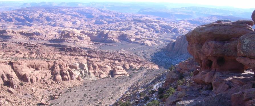 Aerial view from cliff into deep cut canyon