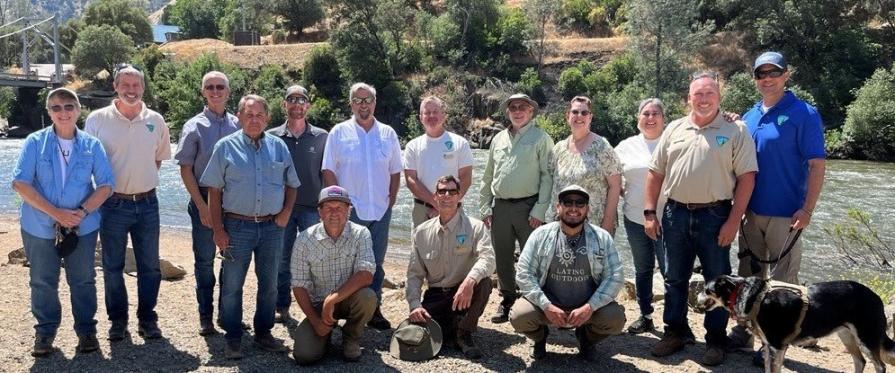 Group photo of Resource Advisory Council on a river bank
