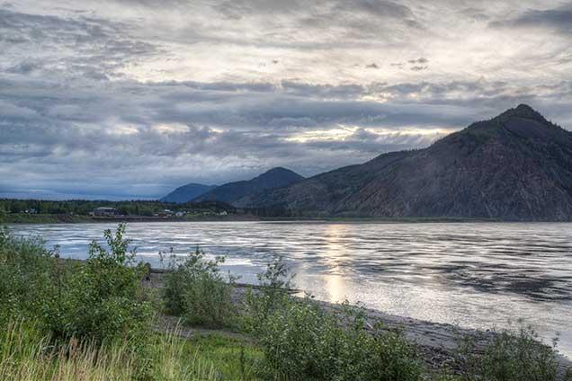 Mountains on other side of large body of water.