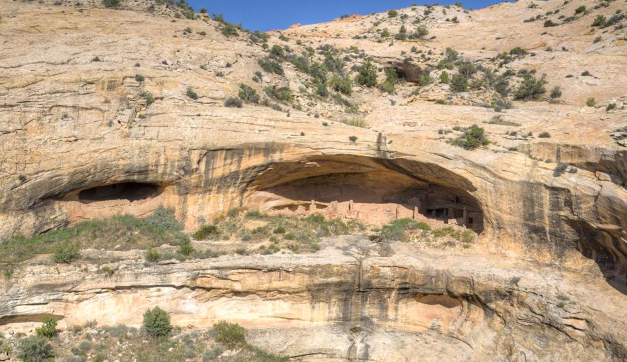 A pueblo home can be seen in an alcove high in the sandstone cliffs of the WSA. 