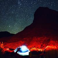 A tent is lit up by lamps in the Big Bend Campground outside Moab, Utah. 