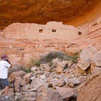 visitor standing in ruins at canyons of the ancients
