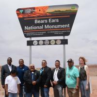 Bureau of Land Management Director Tracy Stone-Manning, the USDA Forest Service Deputy Secretary, and Five Tribal Leaders of the Bears Ears Commission at the Bears Ears National Monument sign unveiling. 