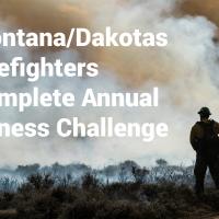 Silhouette of a man standing in front of a lot of smoke. Text says Montana/Dakotas Firefighters Complete Annual Fitness Challenge
