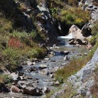 A stream flowing down a river.