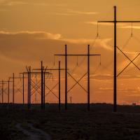 A transmission line at sunset in southern New Mexico.