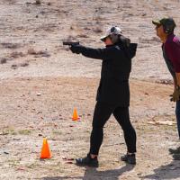 Two shooters at a range. 