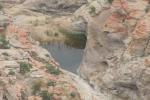 natural pool of water on rocks