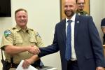 BLM Ranger Curtis Racker shaking hands with Deputy U.S. Marshal Pete Thompson.